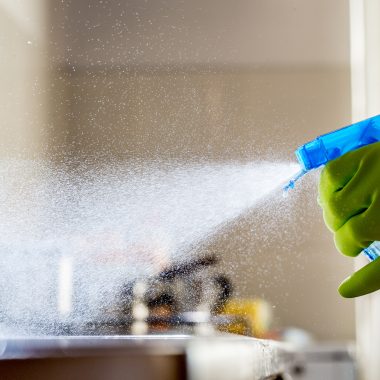 Spraying Cleaning Product on the Kitchen Counter.